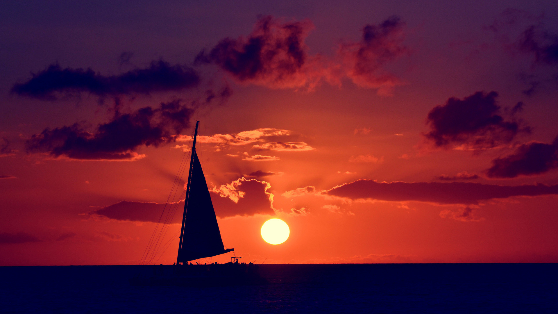 夕阳大海帆船风景桌面高清壁纸